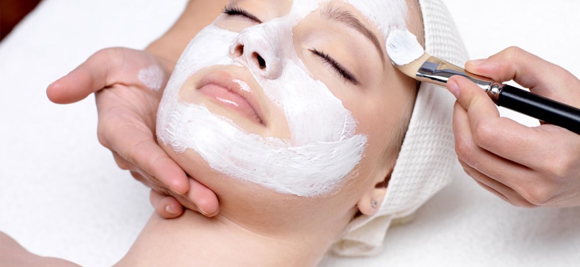 Woman having her face cleansed during a facial treatment at Derma Laser Spas in Sandy Springs, Atlanta.