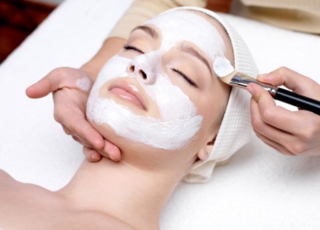 Woman having her face cleansed during a facial treatment at Derma Laser Spas in Sandy Springs, Atlanta.